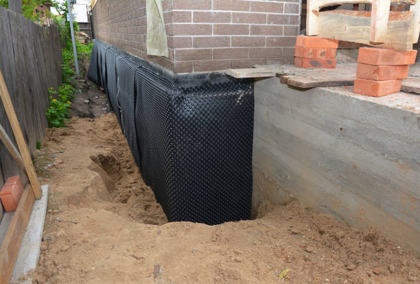 Happy homeowners after waterproofing job in Cleves